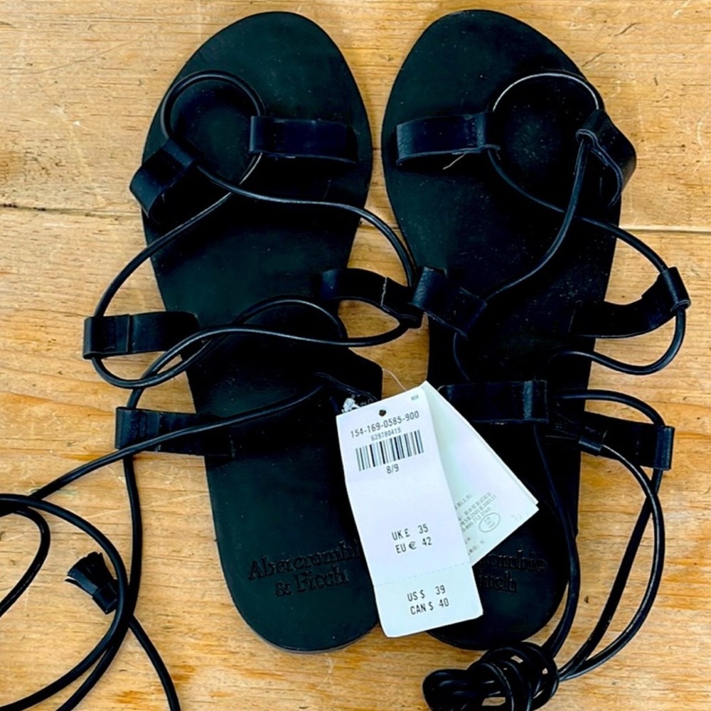 Abercrombie $ Fitch Black Tassel Sandals.